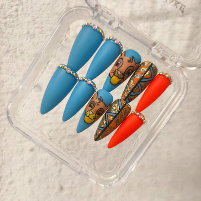 PROMAKE Custom Nails | Savanna Sunset H90065 | Luxury Handmade Press-On Nails,Cute Cartoon Lion Cub Nail Art, Matte Blue & Orange Design, Gold Glitter Tribal Patterns, Rhinestone Accents，Reusable Nail Kit With Tools, Sizes XS–XL